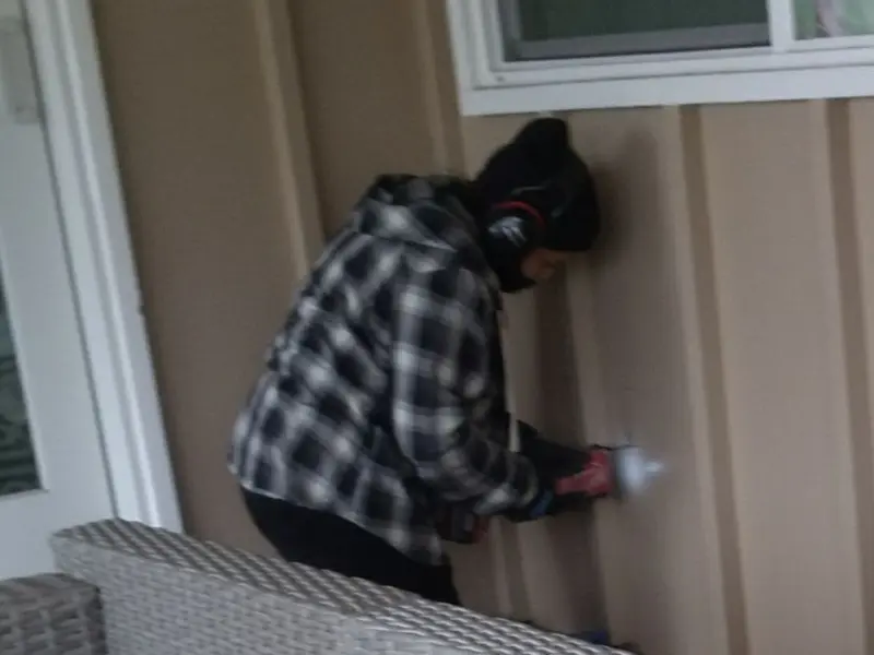 Professional electrician installing an exterior outlet in Corvallis