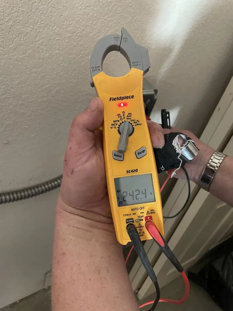 Voltage testing with clamp meter during Recessed Lighting Installation in Corvallis
